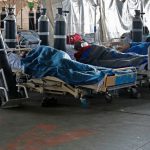 Patients in a temporary ward setup for the treatment of possible COVID-19 Photo by Phill Magakoe